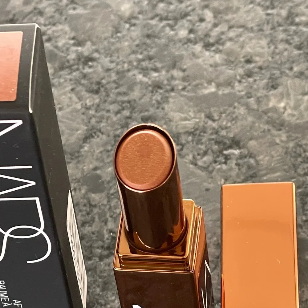 NARS Afterglow Lip Balm in Laguna, a sheer bronze with gold shimmer